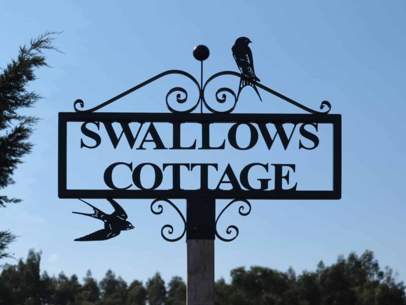 road entrance and road end sign scrolls and swallows