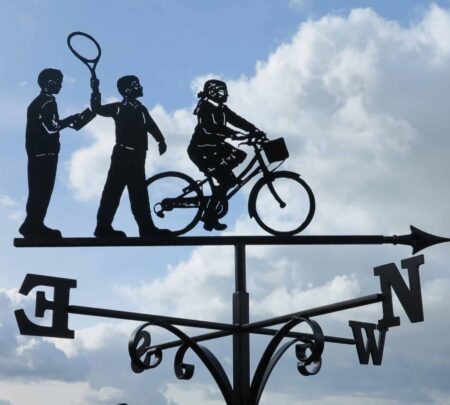 a weathervane with two children and a granny on a bicycle handmade by blacksmiths in Kent