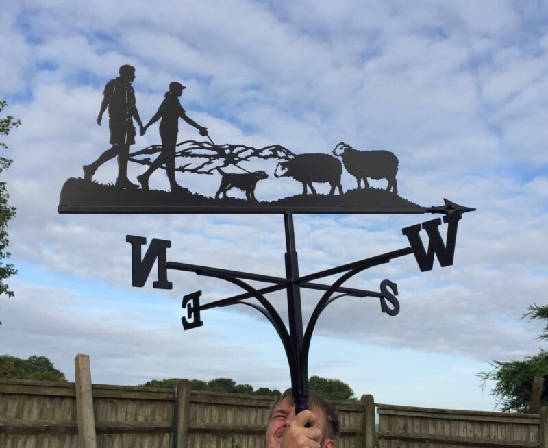 Couple Walking Hills, Sheep And Border Terrier Weathervane